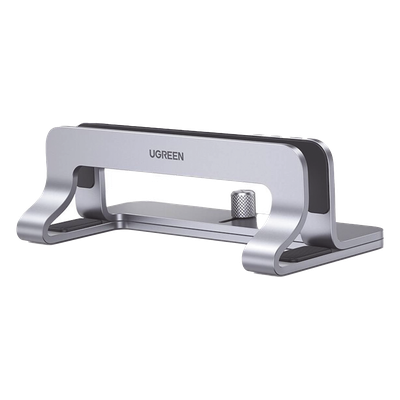 Soporte Vertical para Laptop / Adecuado para escritorio / Anchura Ajustable (12-26mm) / Amplia compatibilidad / Anti-Arañazos / Anti-Deslizante /Ajustable Mediante Tornillos / Color Plata / Aluminio + Silicona